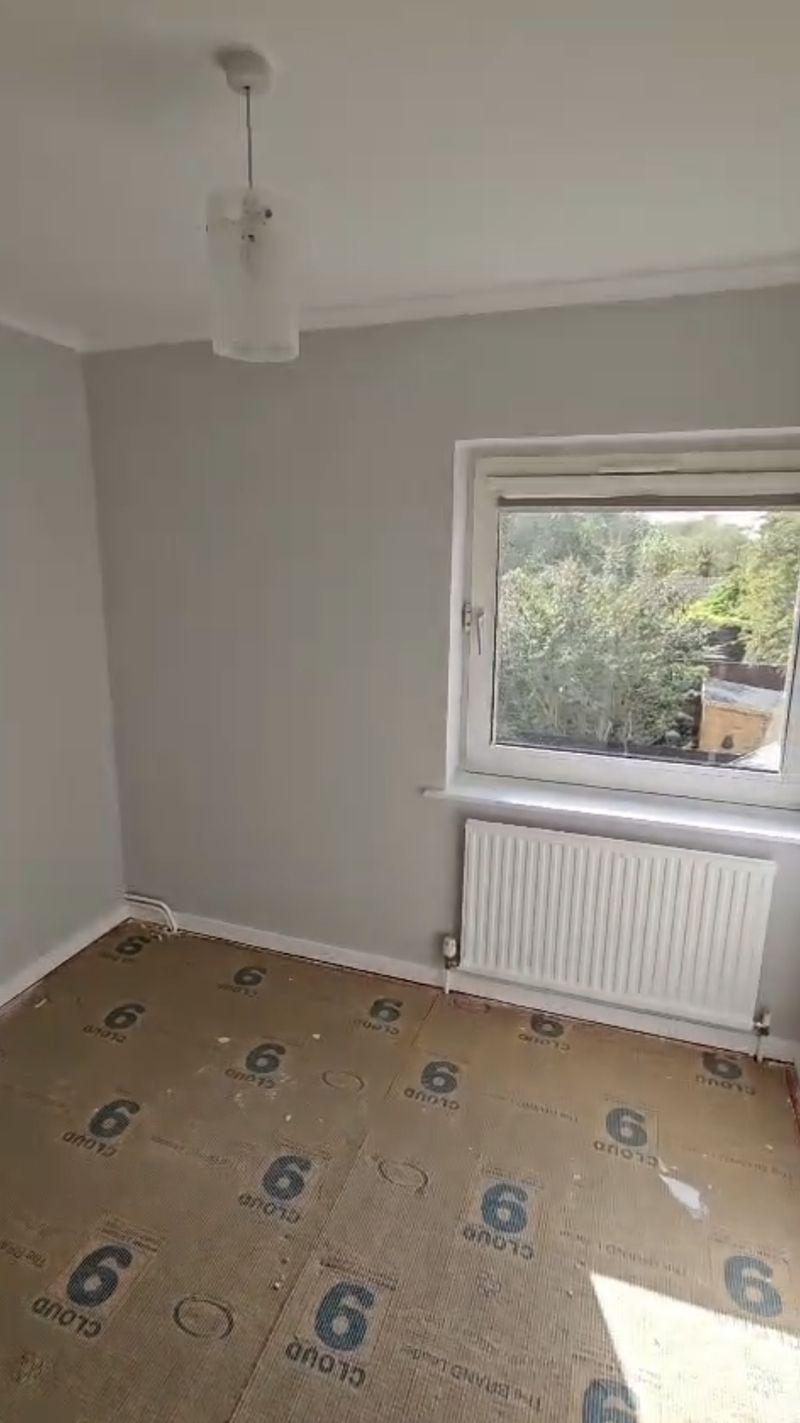 The finished room repainted in light grey, photo 1 of 2
