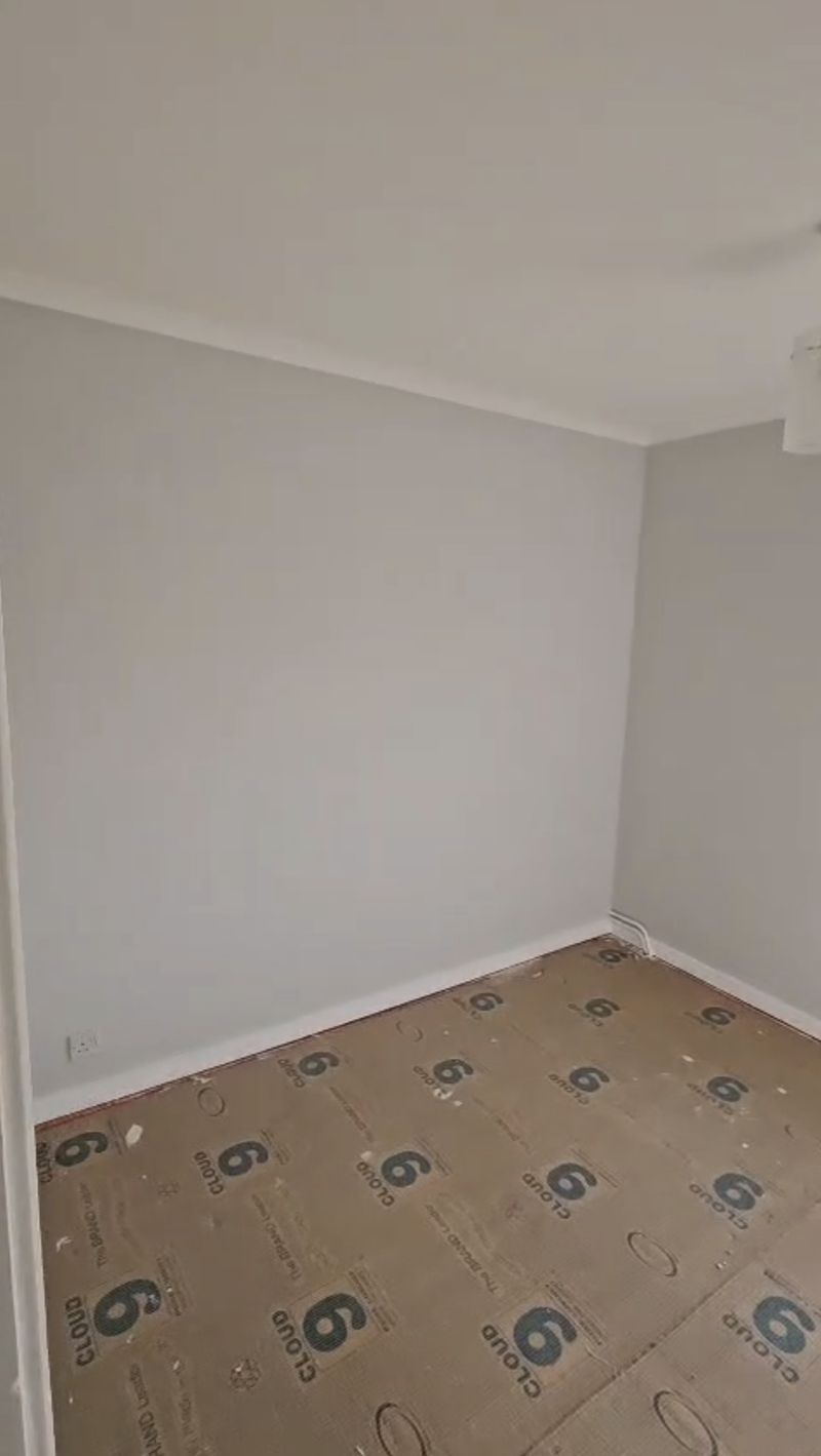 The finished wall in light grey, photo 2 of 2