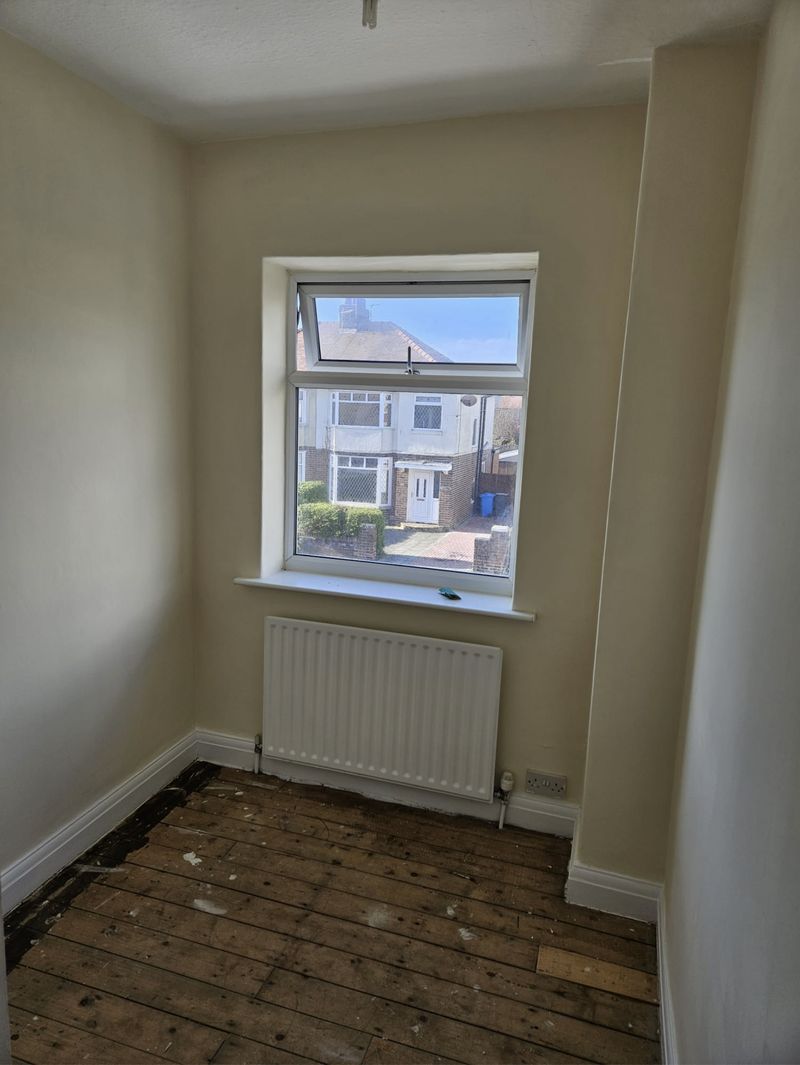 The same room with clean, freshly painted walls and woodwork